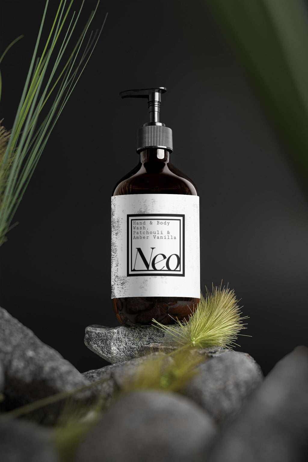 Bottle of Neo product on a rock with grass and dark background