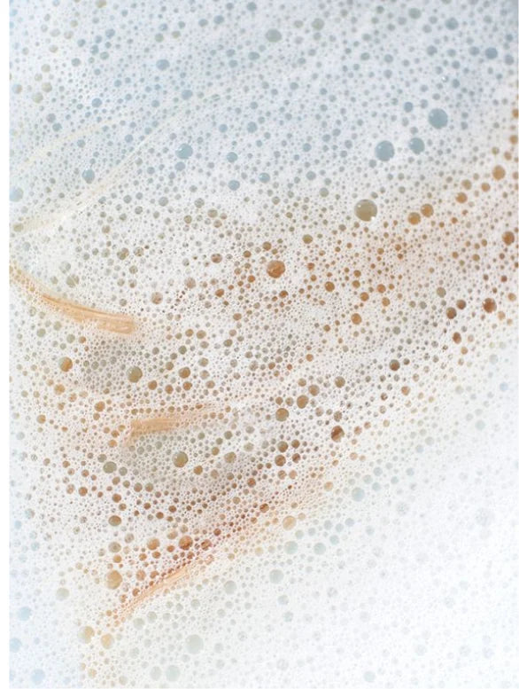 Close-up of soap bubbles on a white background