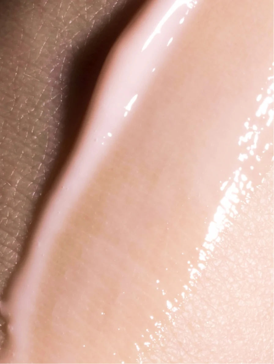 Close-up of a smooth, beige-colored surface with a soft focus.