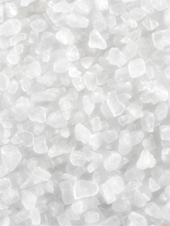 Close-up of white pebbles on a light gray background