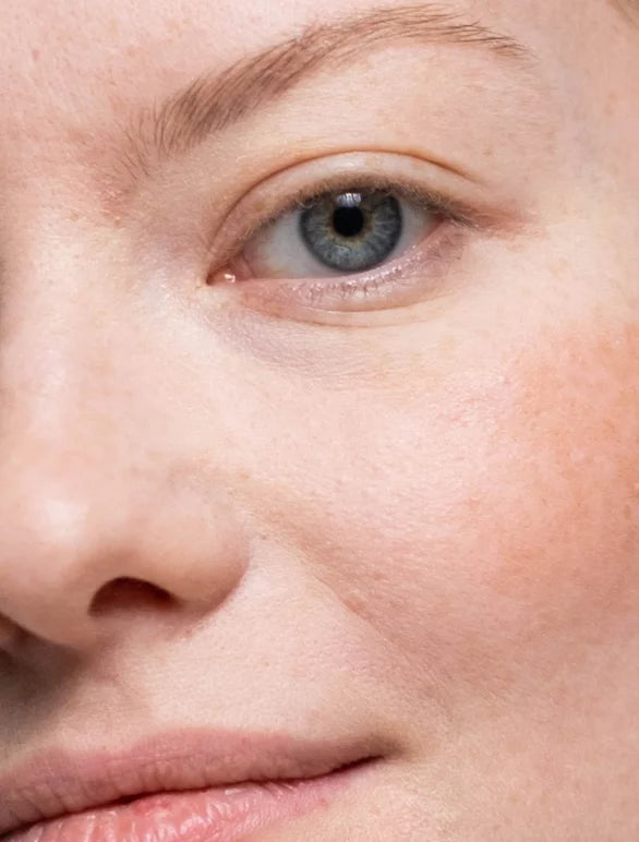 Close-up of a person's eye with a light background