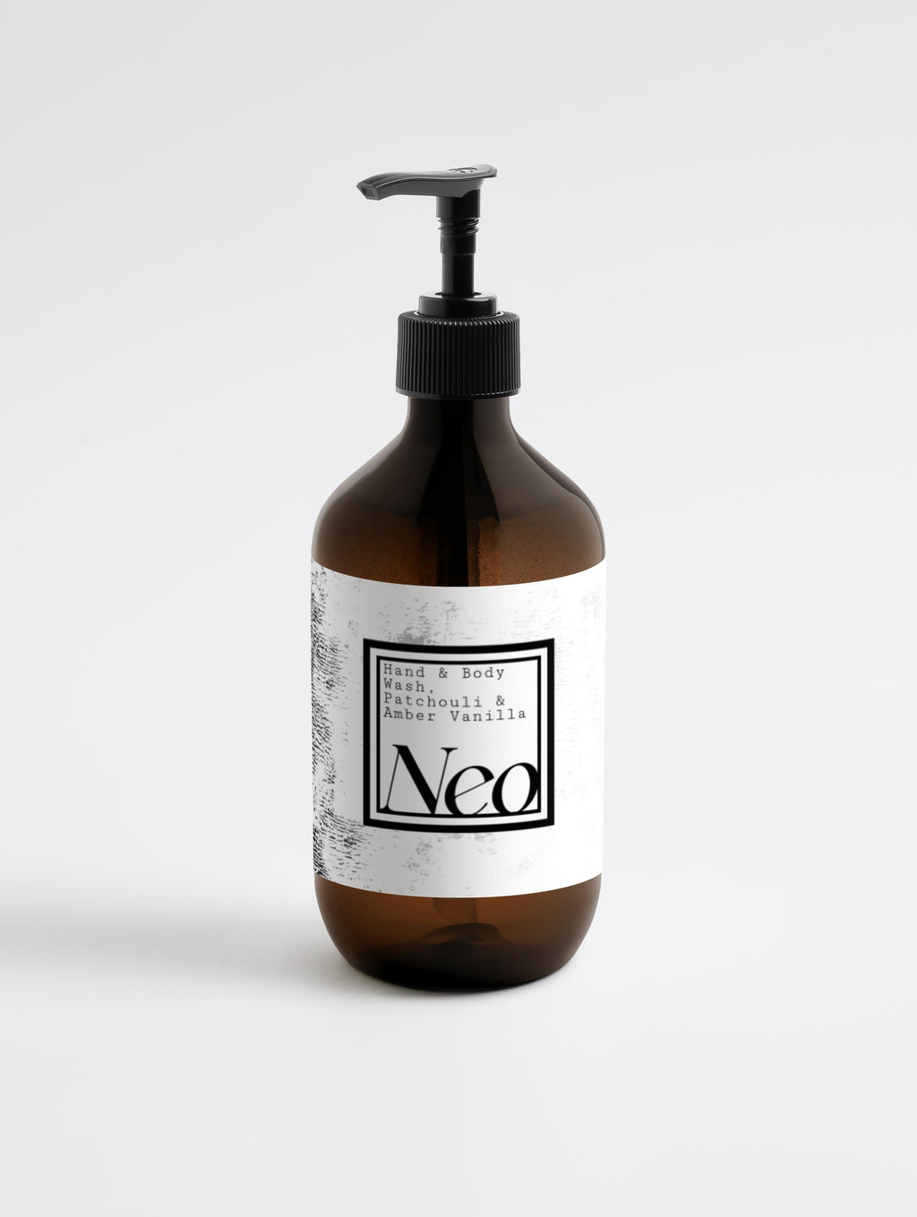 Brown bottle with pump and white label on a light gray background